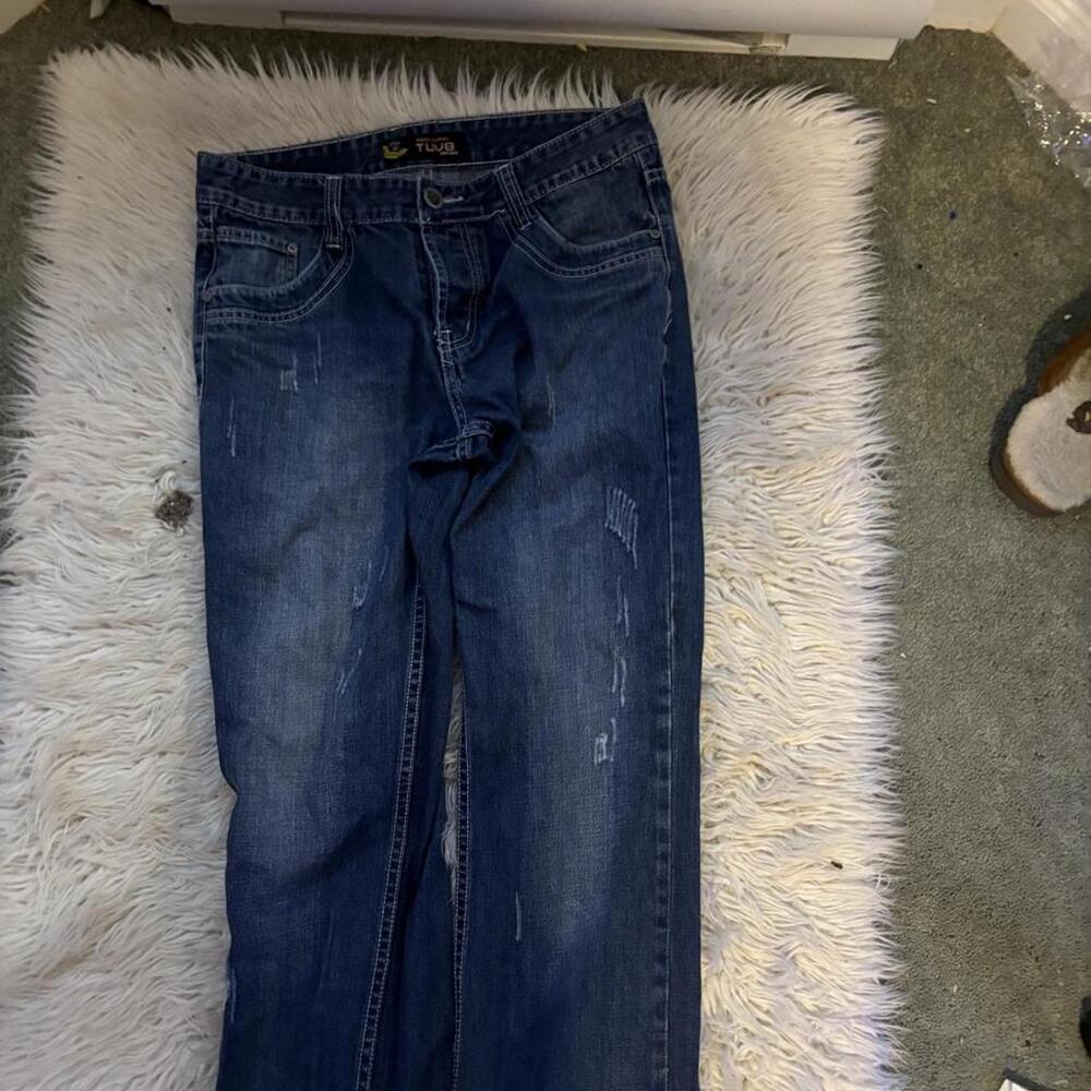 Blue denim straight fit jeans with a distressed look
